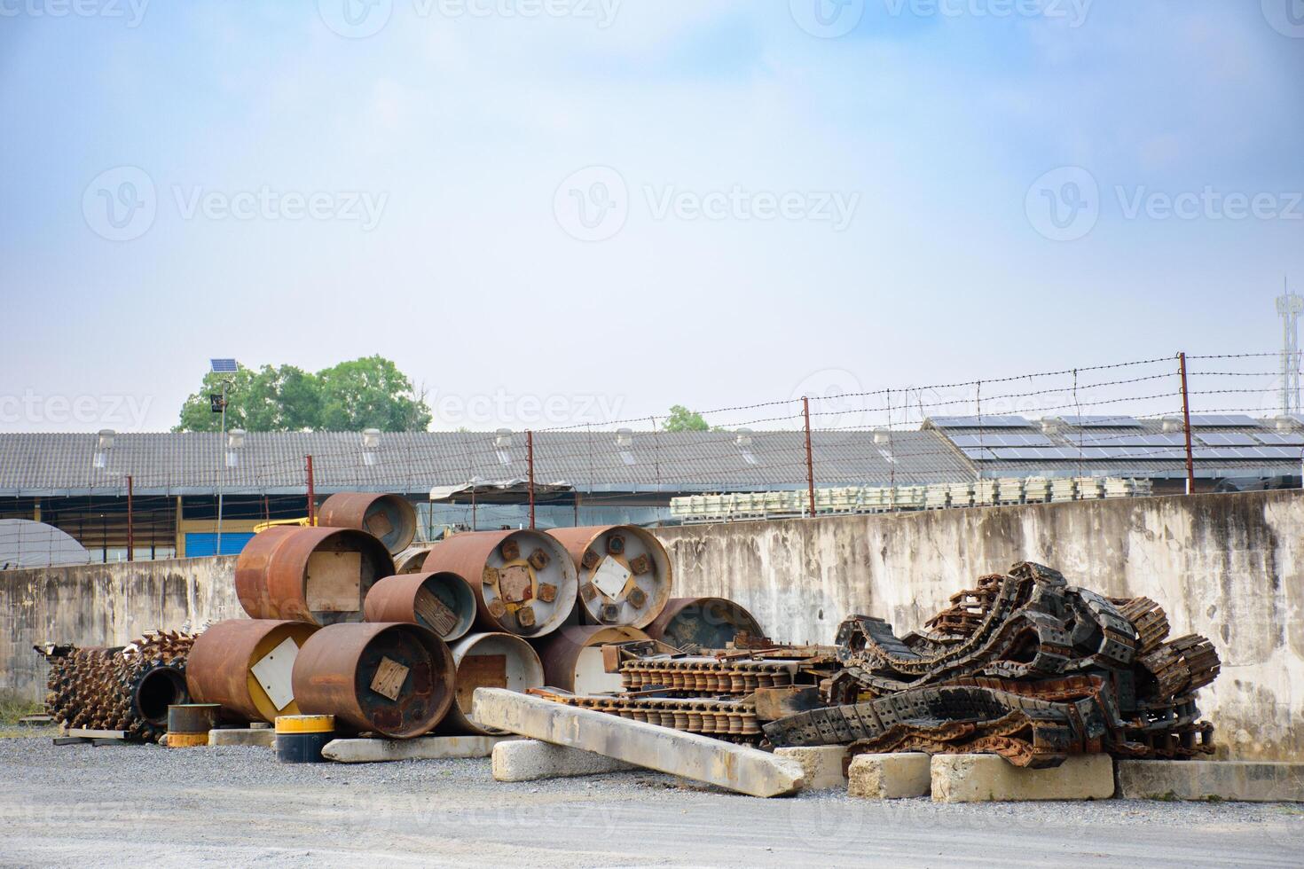 Industrial scrap metal that rusts is automotive industry parts and metal parts of large machines. Pile of various rusted industrial steel equipment on the floor in an factory 2025. photo
