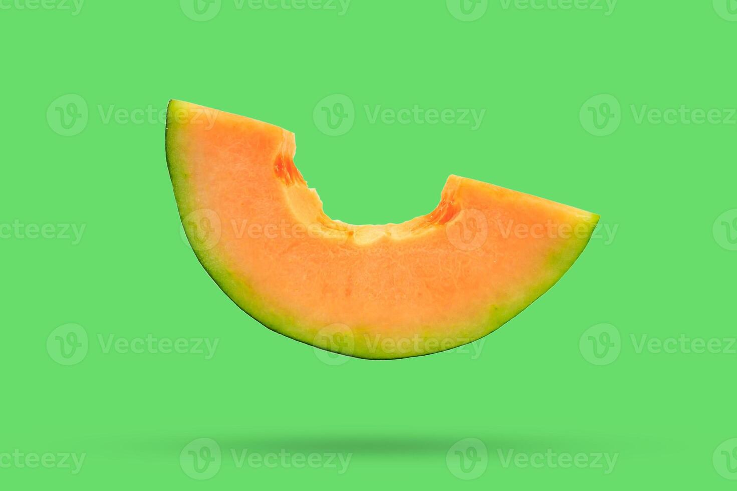 cantaloupe melon slices isolated on green background photo