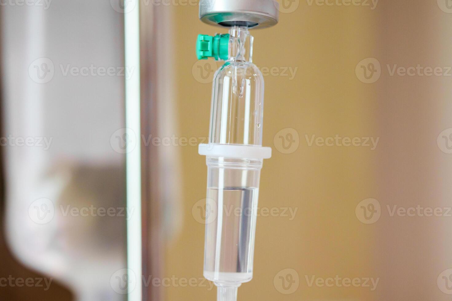 Close up medical intravenous IV drip in hospital background photo