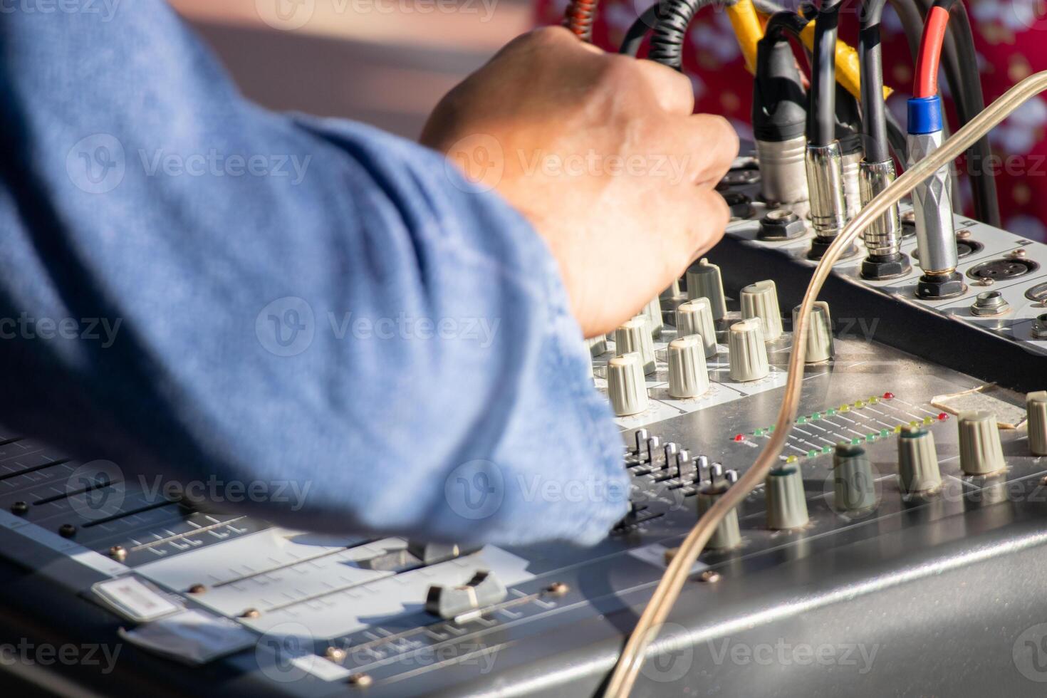Technician using sound audio mixing system photo