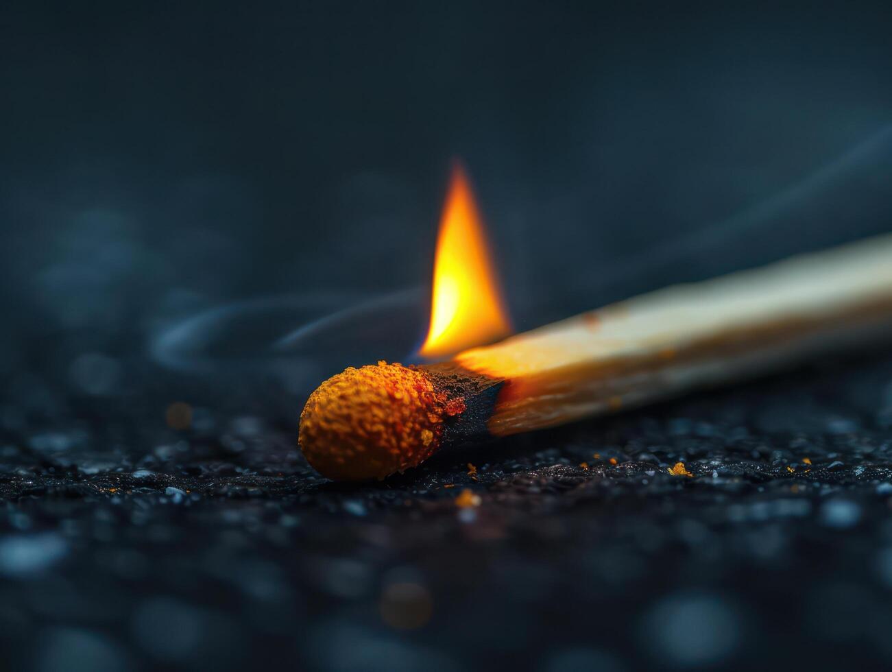A single matchstick on the side points to the left. on a black background photo