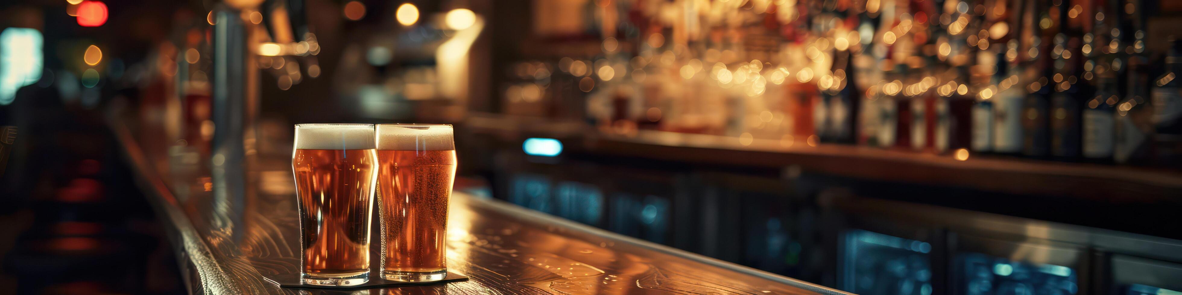 Bar counter with two bottles of beer photo