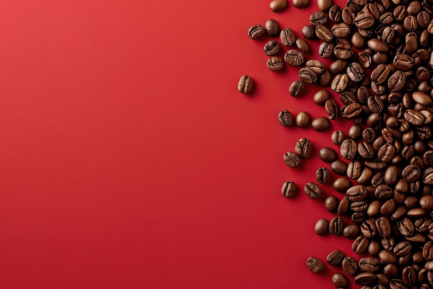 Coffee beans viewed from above scattered on a red background. photo