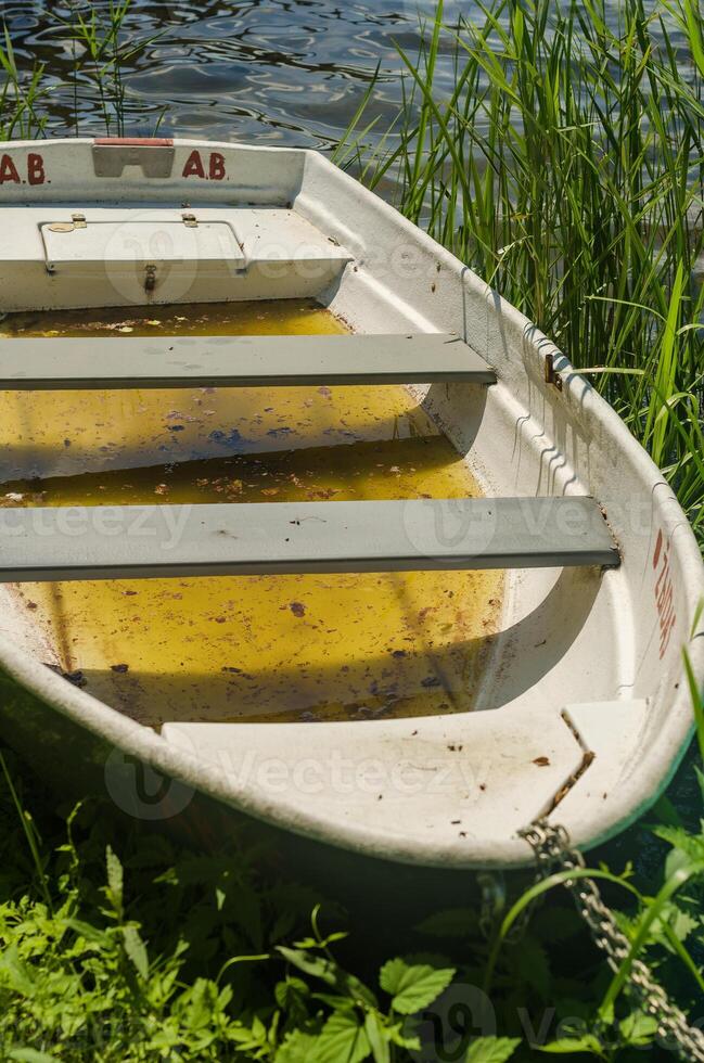 old classic dinghy floating in the pond. High quality photo