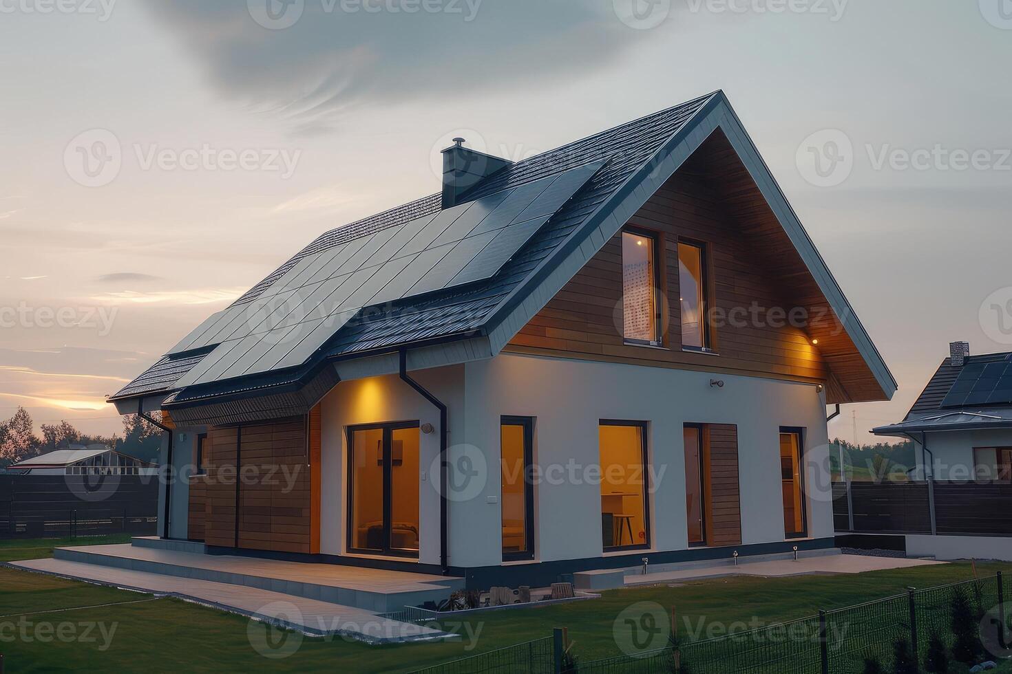 New suburban house with a photovoltaic system on the roof. Modern eco friendly passive house with solar panels on the gable roof photo