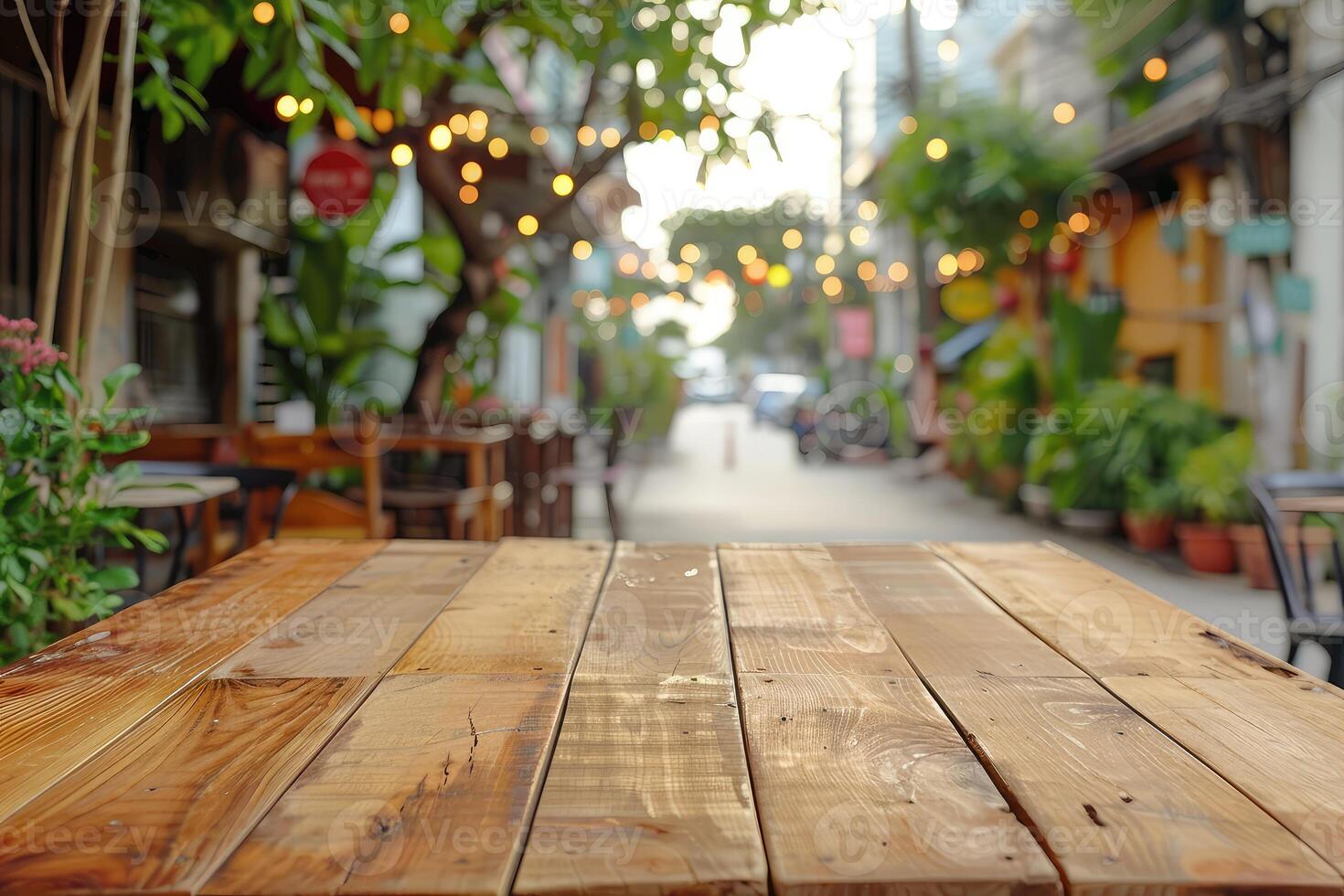 Empty natural wood table top in outdoors terrace, cafe. Empty backdrop on empty wooden table for food, drink, product with city street background photo