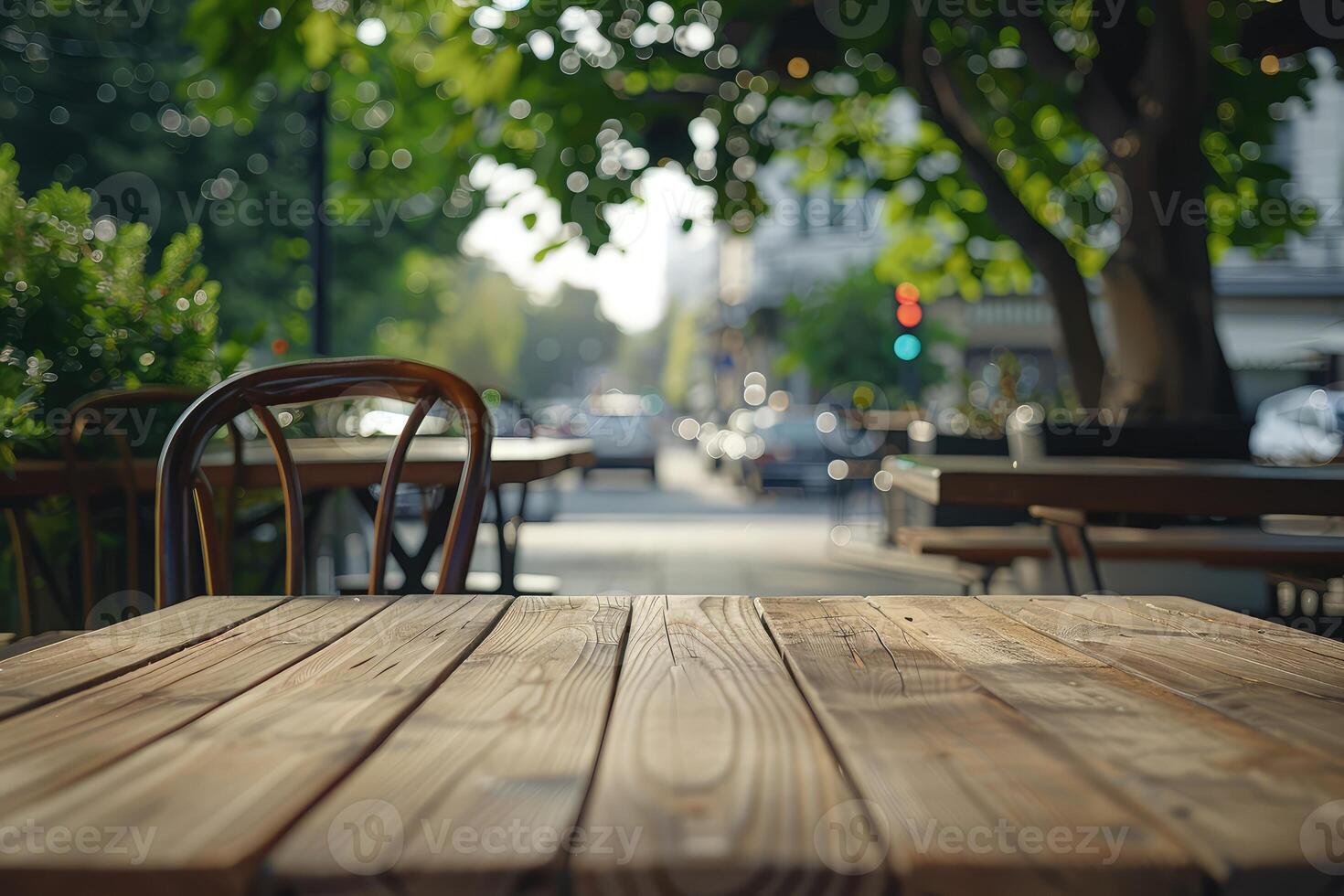 Empty natural wood table top in outdoors terrace, cafe. Empty backdrop on empty wooden table for food, drink, product with city street background photo