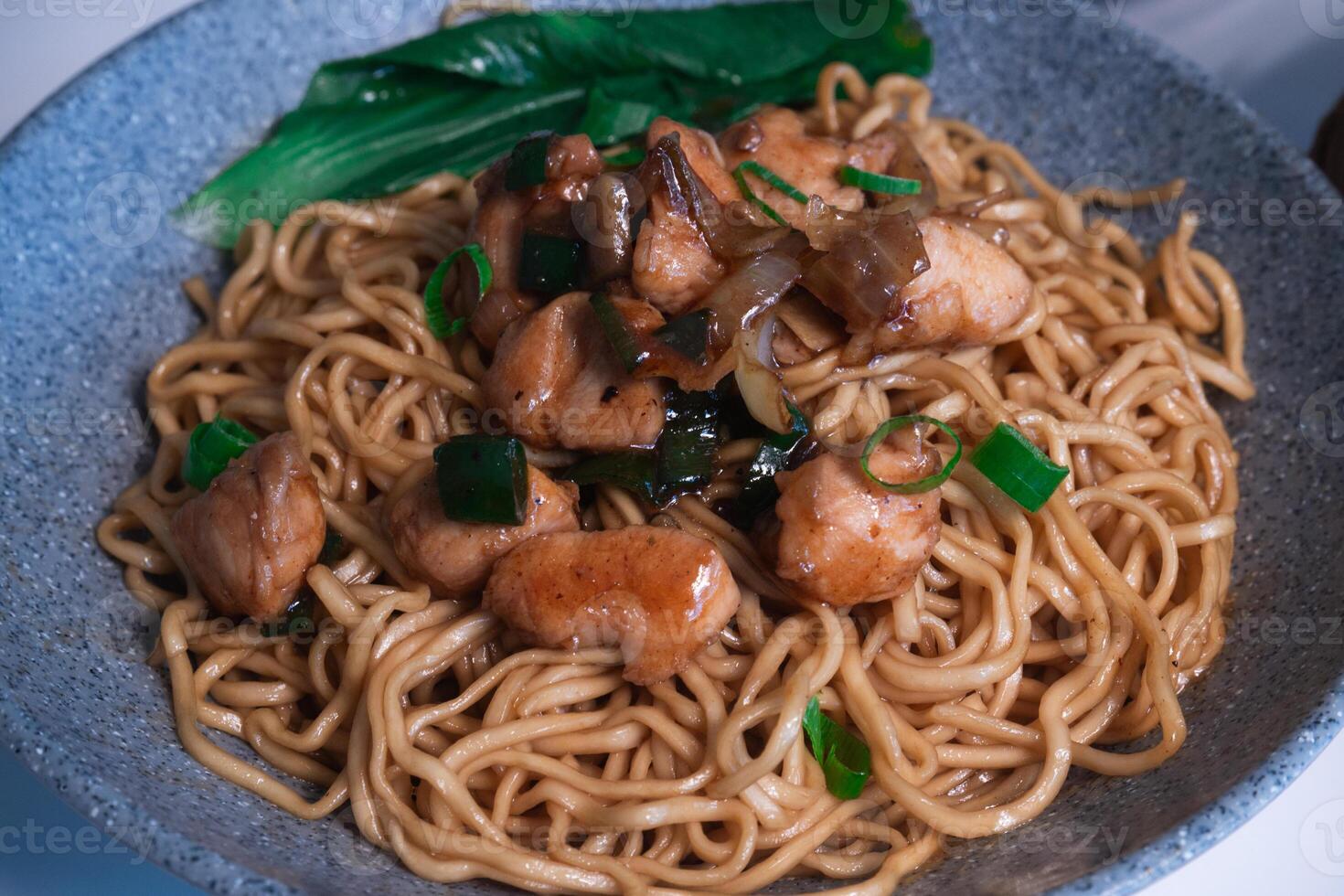 Mie Gacoan Sign with clear blue sky. A spicy noodle restaurant in ...