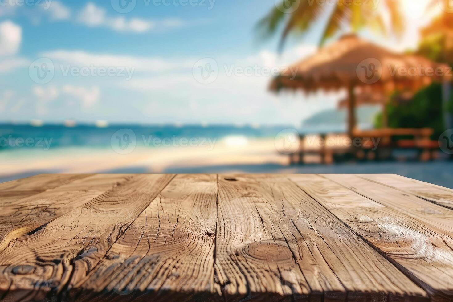 Empty wooden table top with copy space for food drink product advertising with blurred summer resort beach bar restaurant background photo