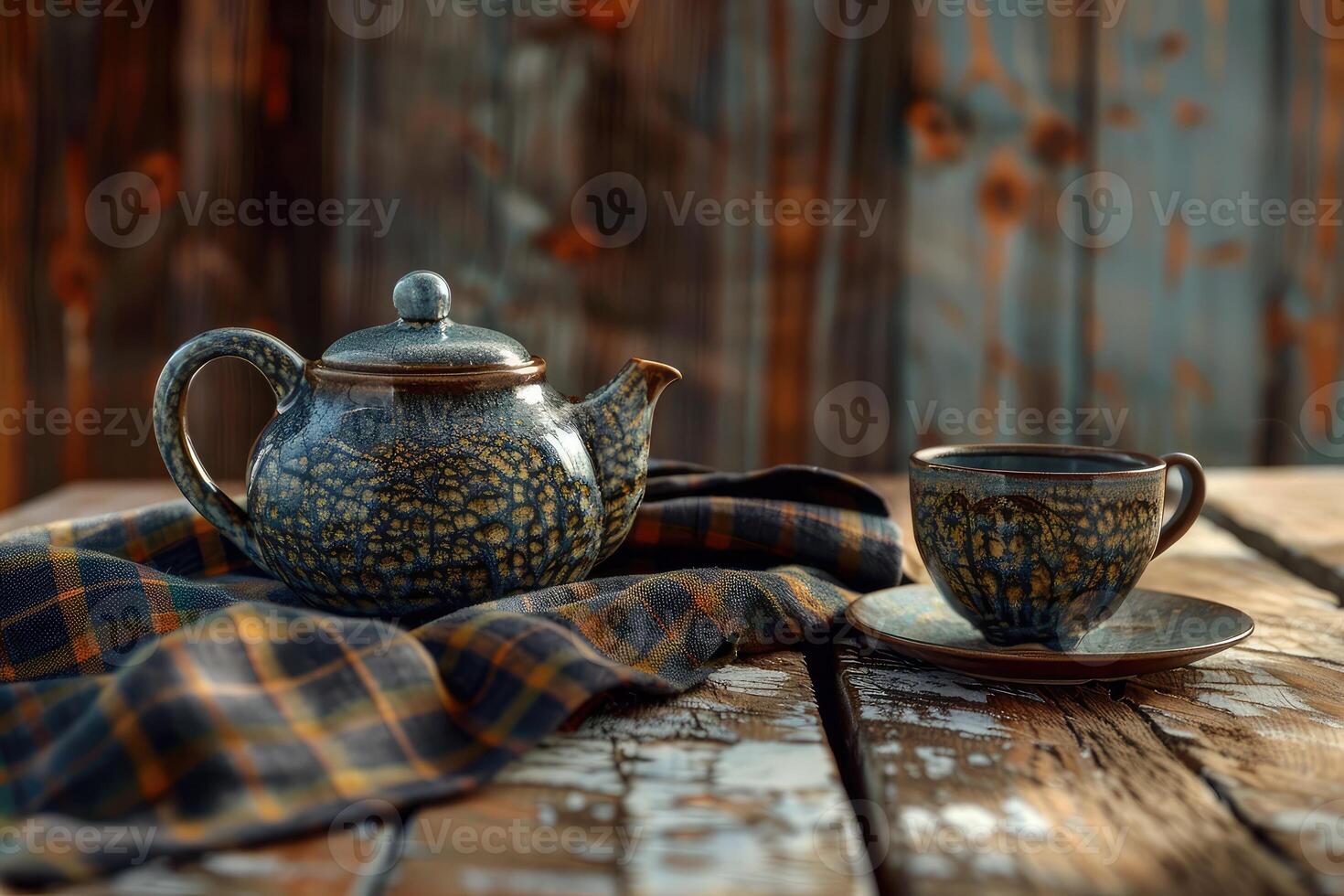 A ceramic tea pot and cup on a rustic wooden table with a plaid tablecloth, evoking a health and ceremony concept. photo