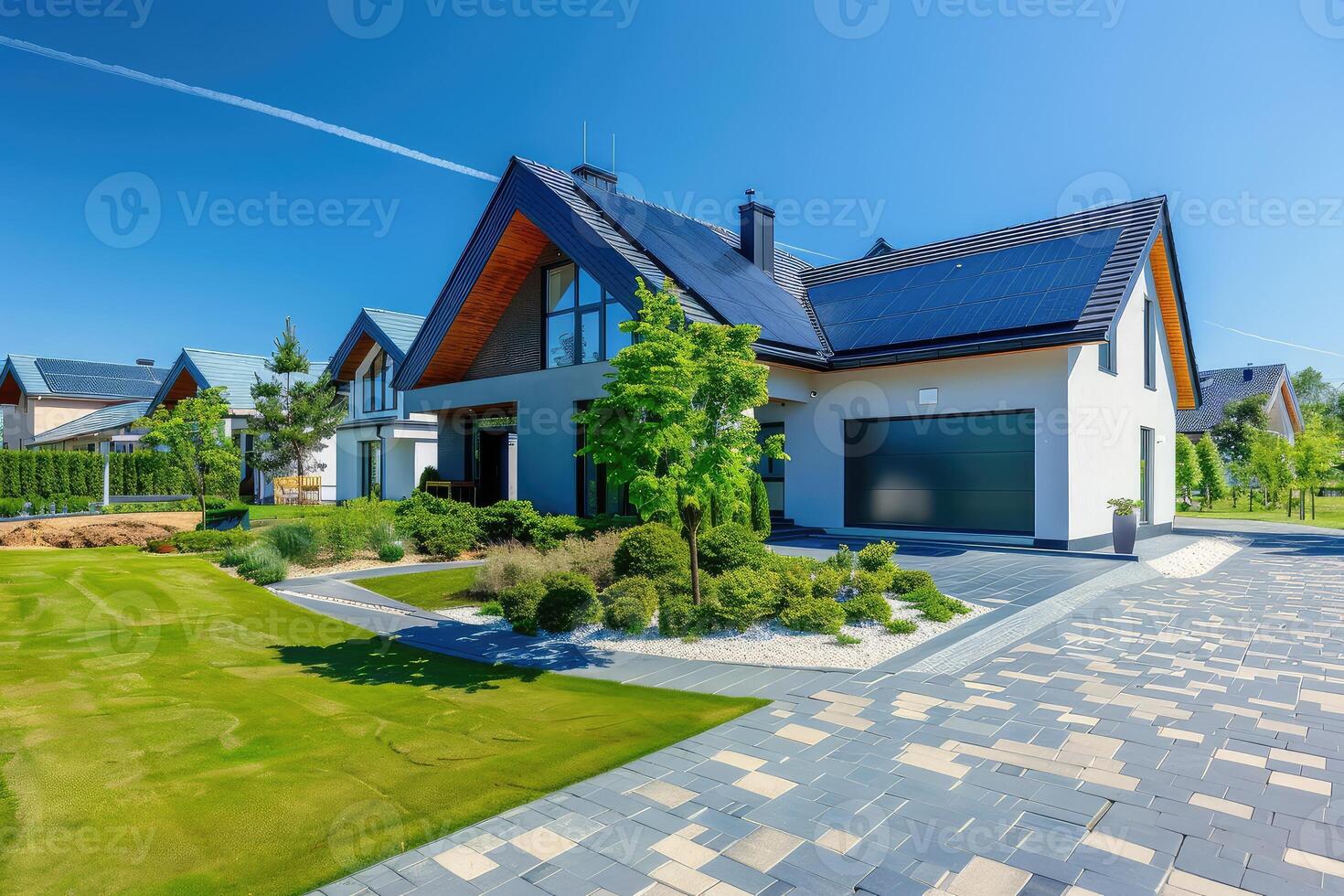 New suburban house with a photovoltaic system on the roof. Modern eco friendly passive house with solar panels on the gable roof photo