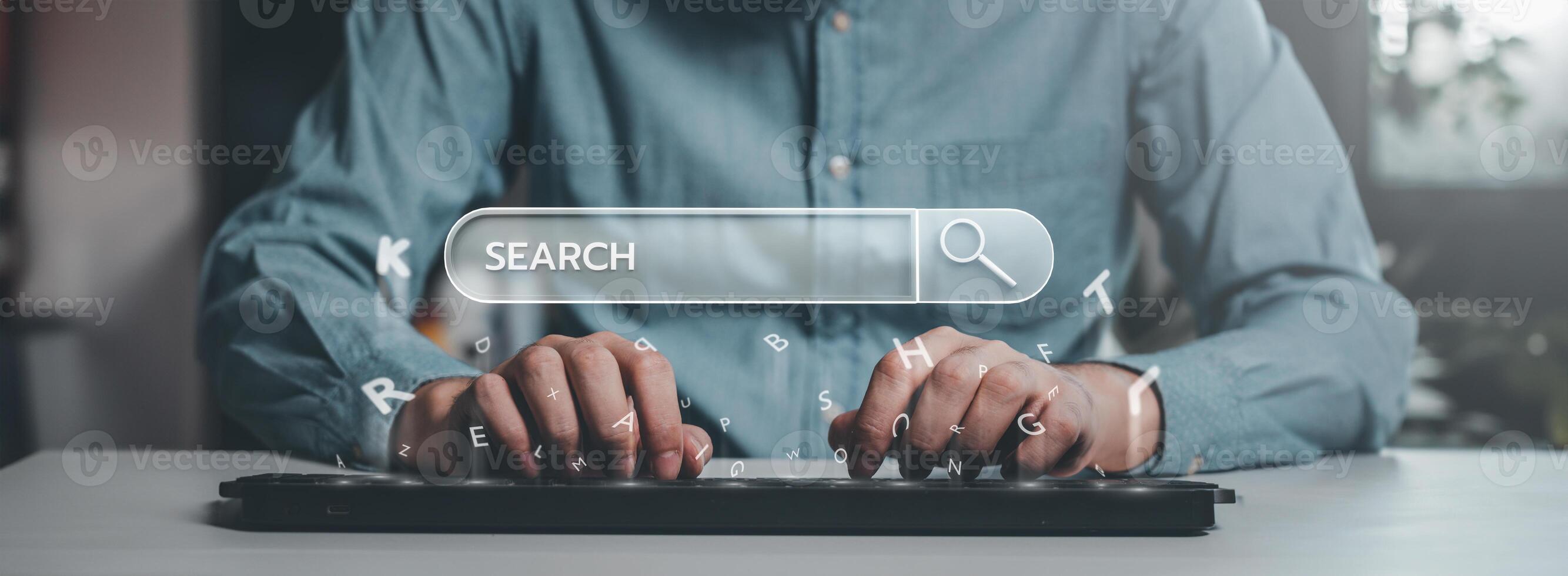 Typing on a keyboard with search bar overlay photo