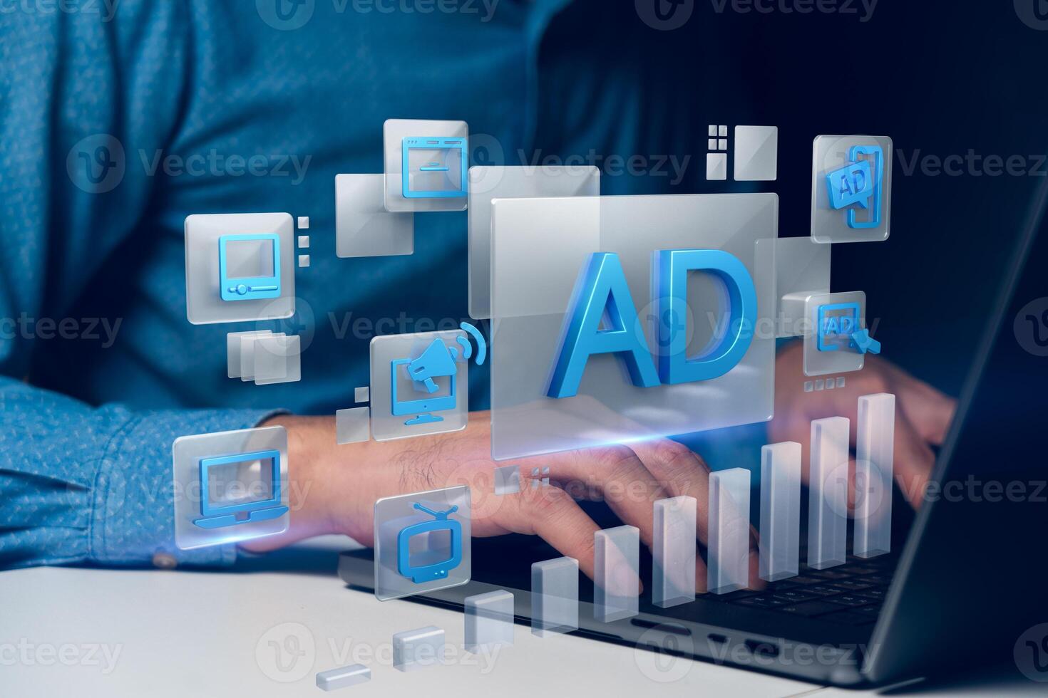 A person working on a laptop with floating digital marketing icons such as ads, computers, and graphs photo