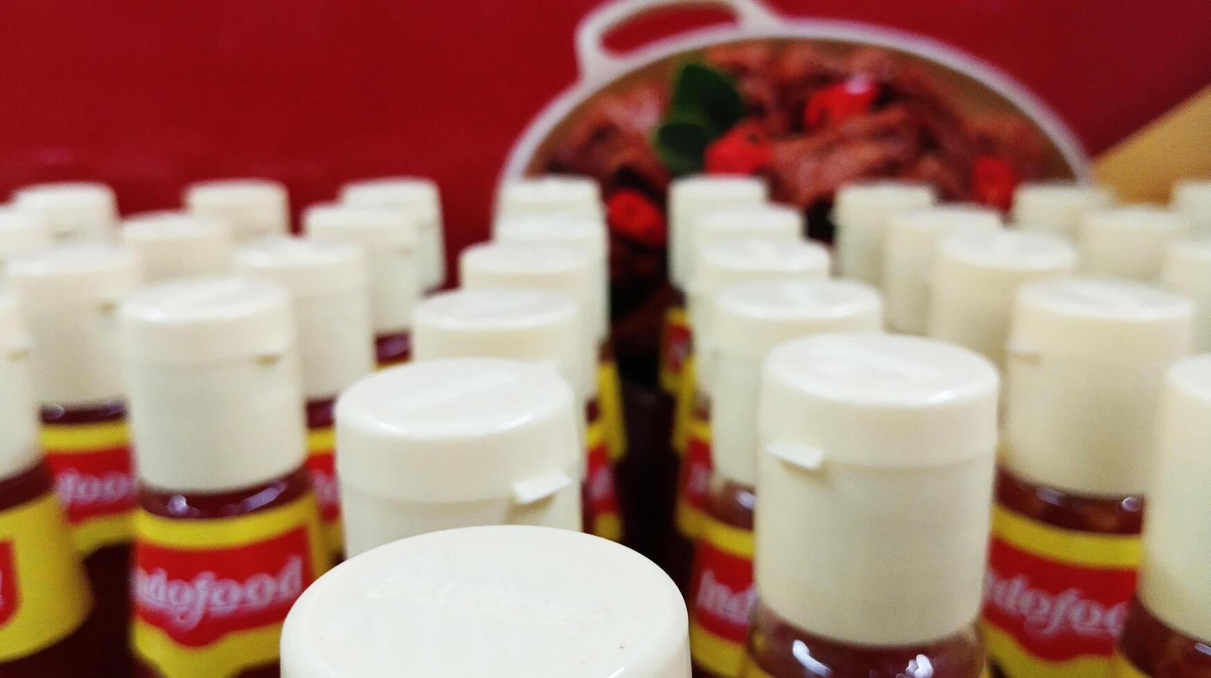 Semarang, Indonesia - March, 2024 - sauce bottle caps lined up photo