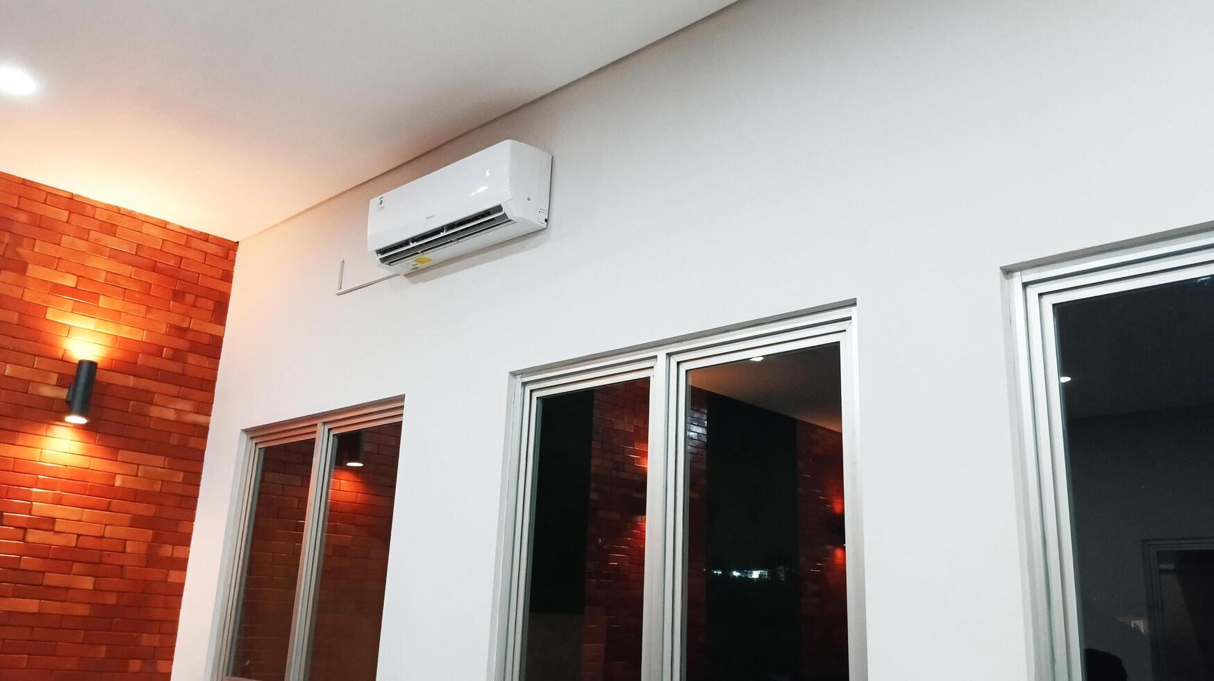 a room with a window. lights and air conditioning photo