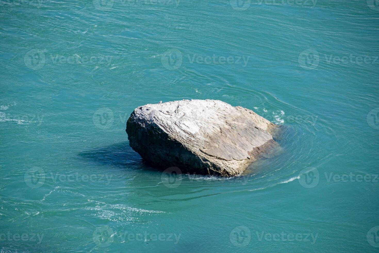 One big beautiful rock in the ocean. photo