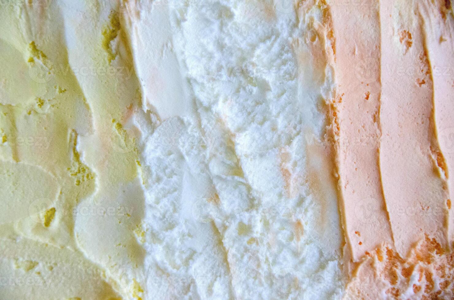 texture of yellow white and green ice cream like background, close up photo