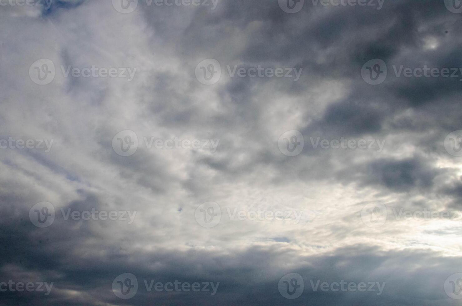 White passenger airplane flying in the sky amazing clouds in the background photo
