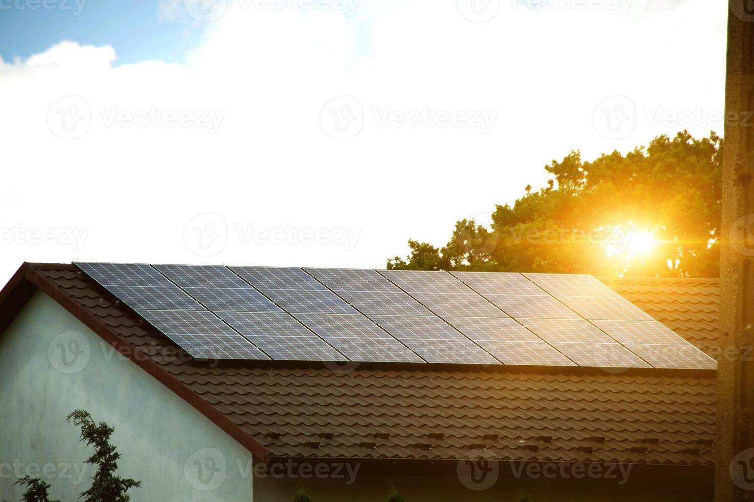 Solar power energy on the roof to a standard house photo