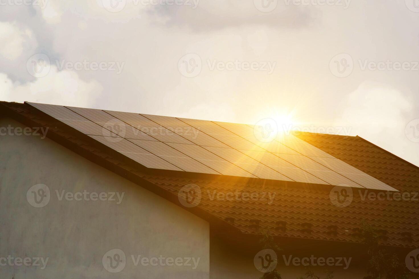 Solar power energy on the roof to a standard house photo