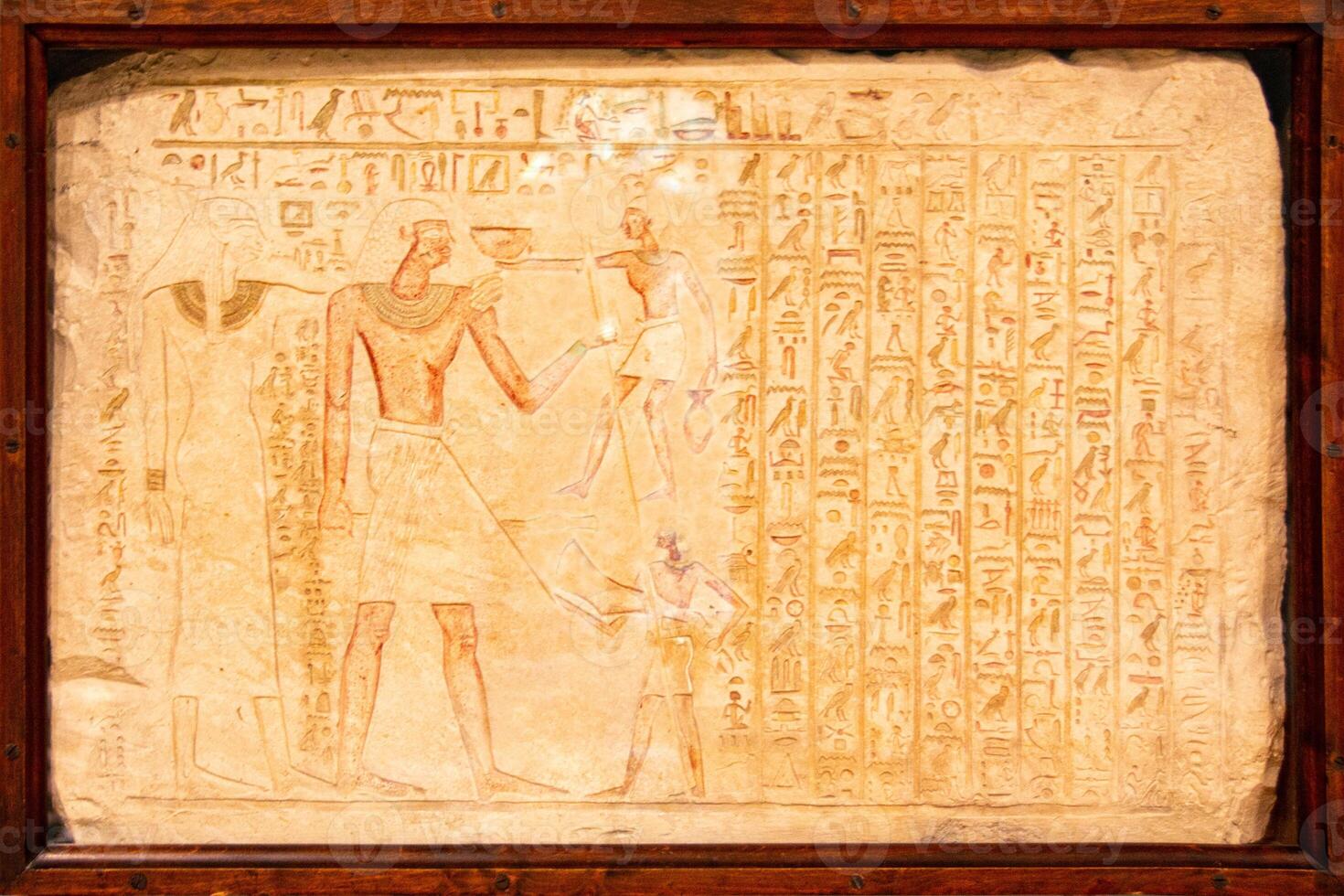Old Egyptian hieroglyphs on an ancient background. photo