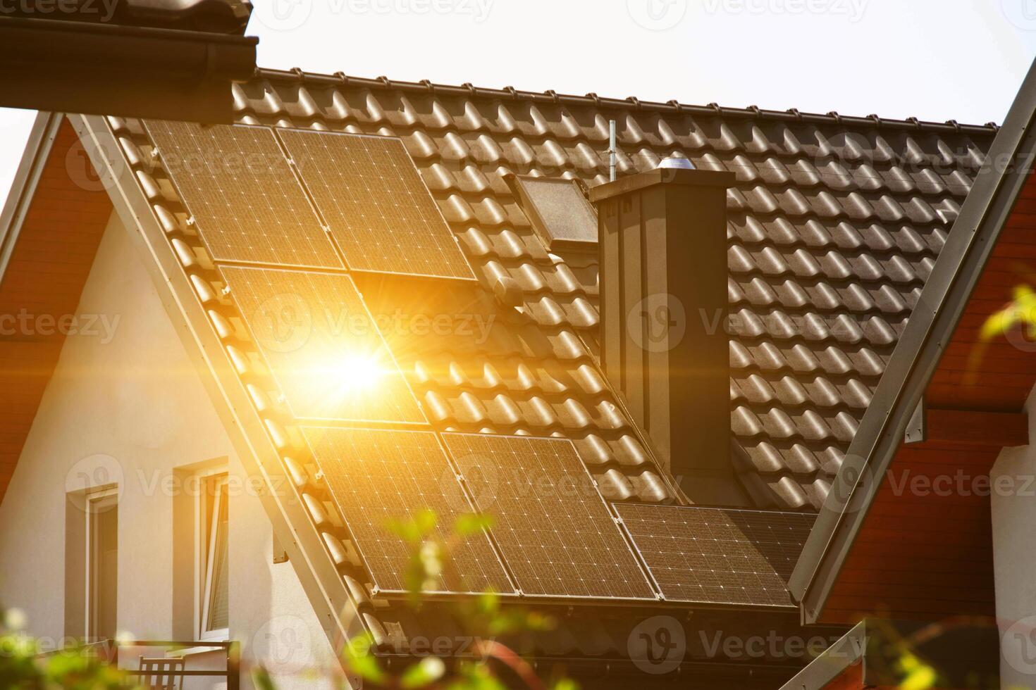 Solar power energy on the roof to a standard house photo