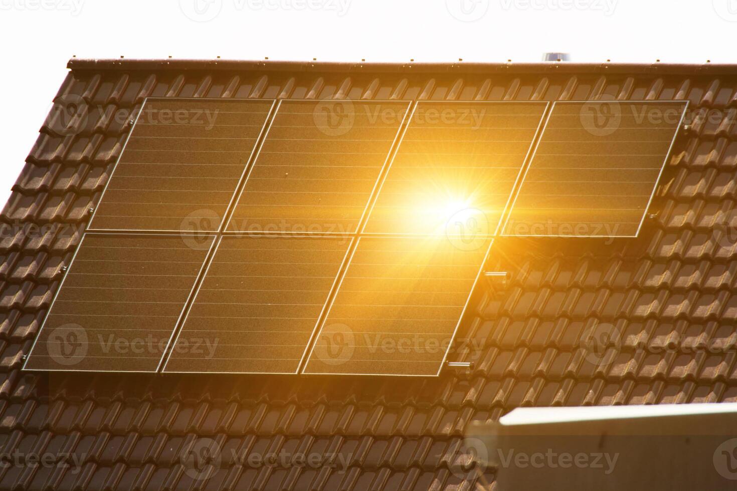 Solar power energy on the roof to a standard house photo