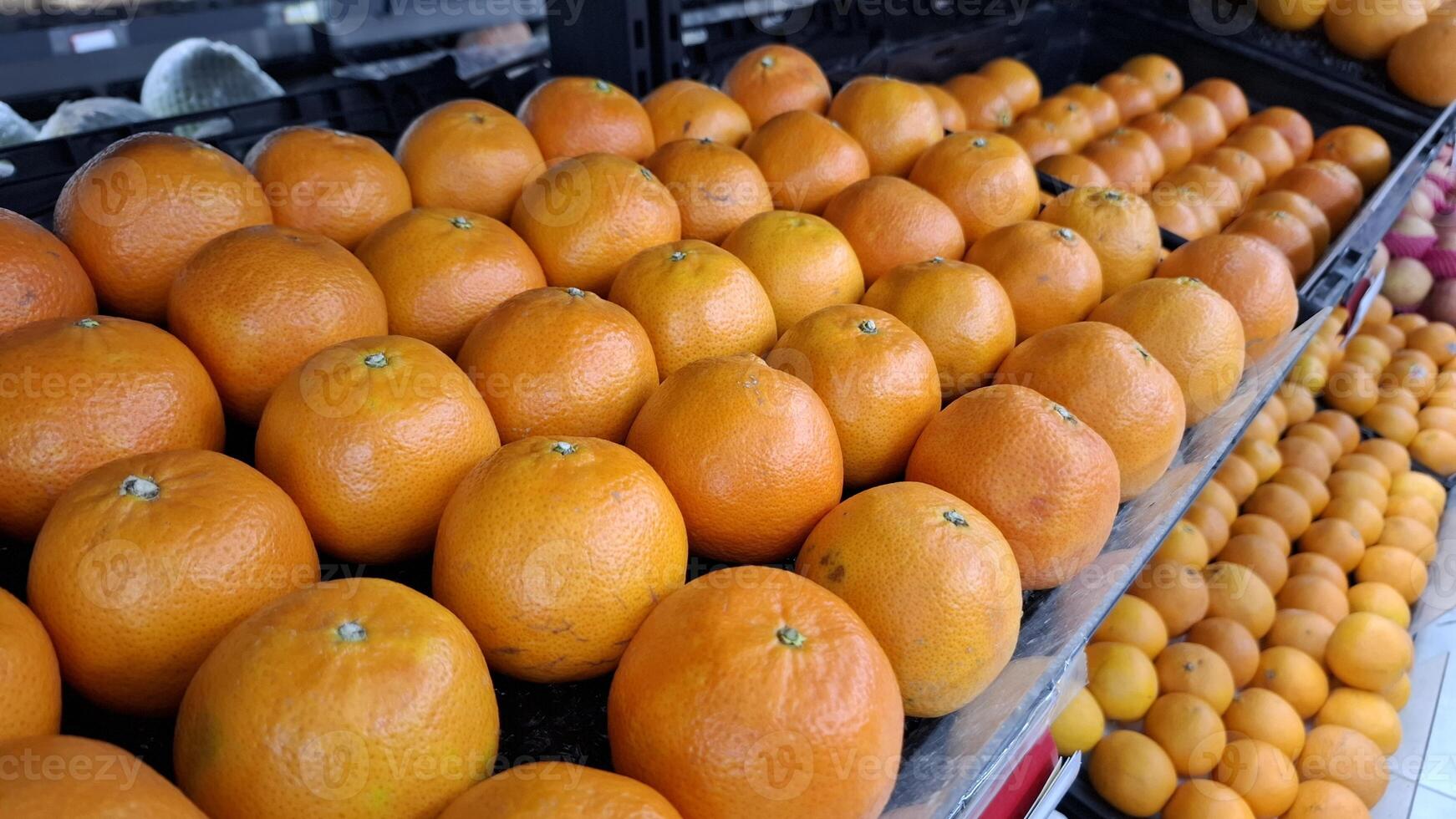 A Fresh Display of Oranges in a Grocery Store photo