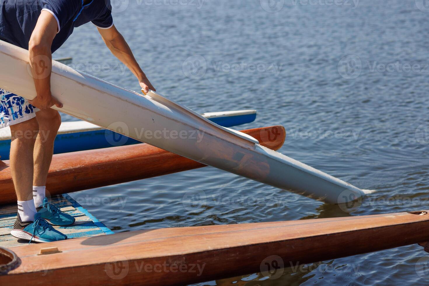 athlete putting on water kayak, water sport, kayaking and canoeing, olympic games photo