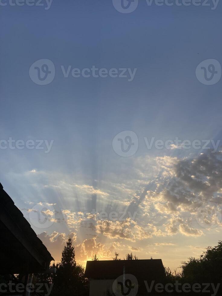 Clouds at sunset on a hot summer day photo