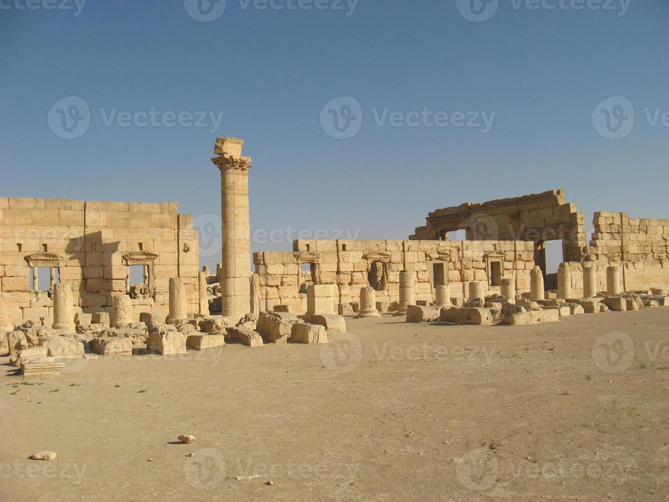 The Bel Temple in Palmyra, Syria, is an ancient architectural marvel. Majestic columns and intricate carvings adorn its facade, reflecting a blend of Roman and Semitic influences. The temple, dedicate photo