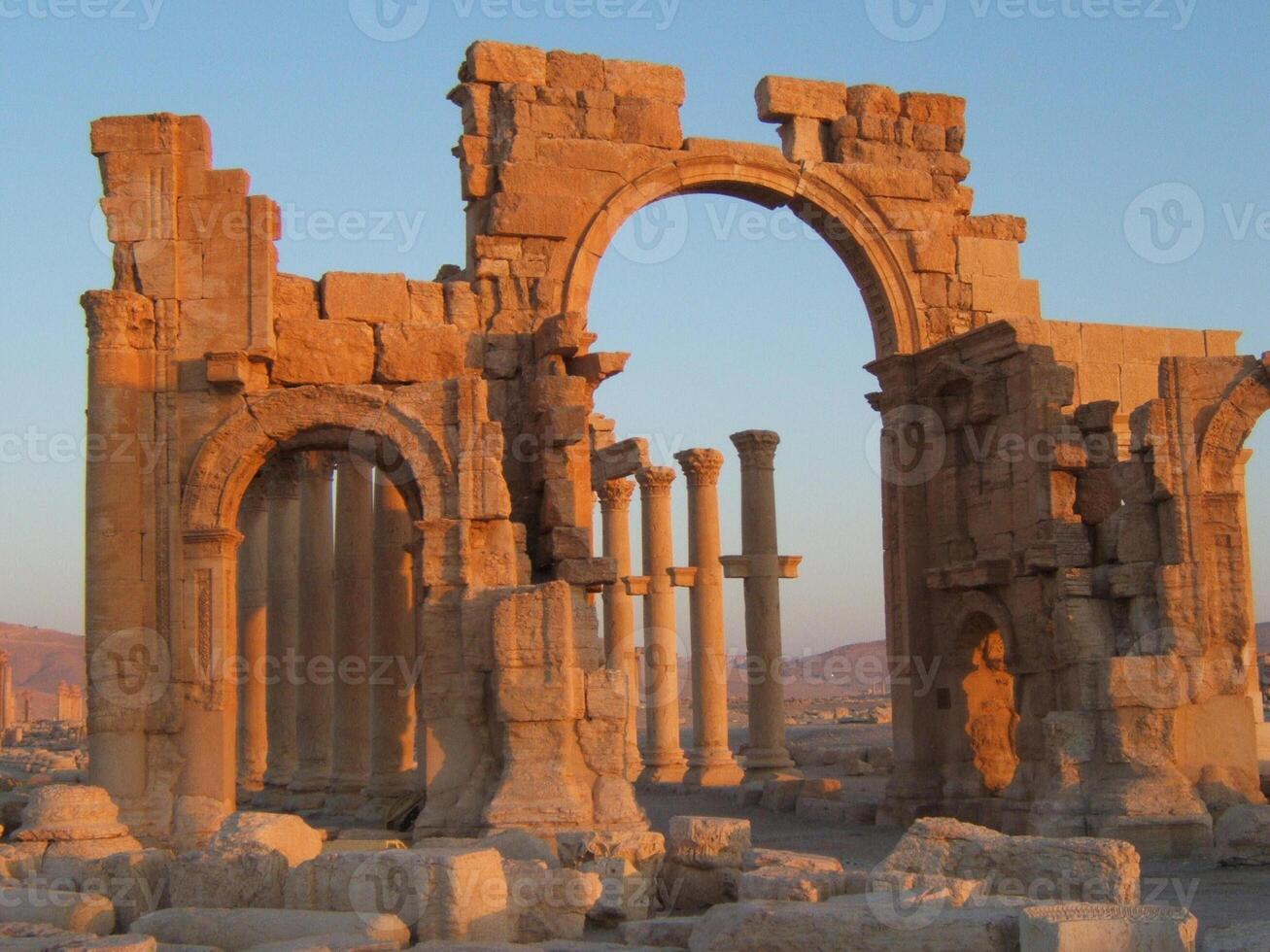 The Bel Temple in Palmyra, Syria, is an ancient architectural marvel. Majestic columns and intricate carvings adorn its facade, reflecting a blend of Roman and Semitic influences. The temple, dedicate photo