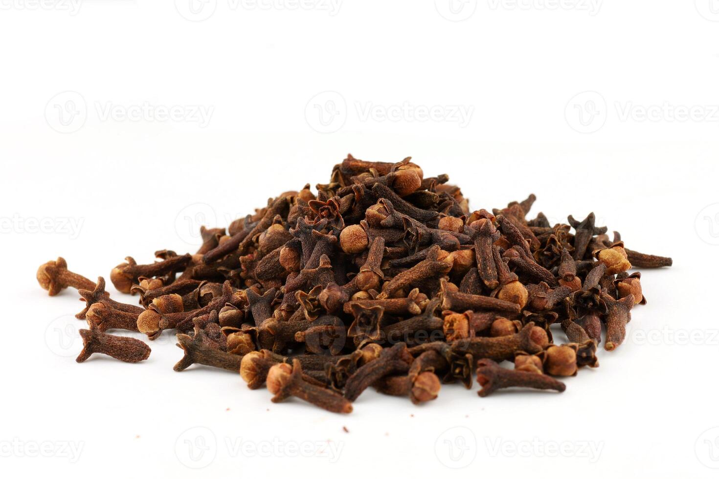 Clove spice pile on white isolate photo