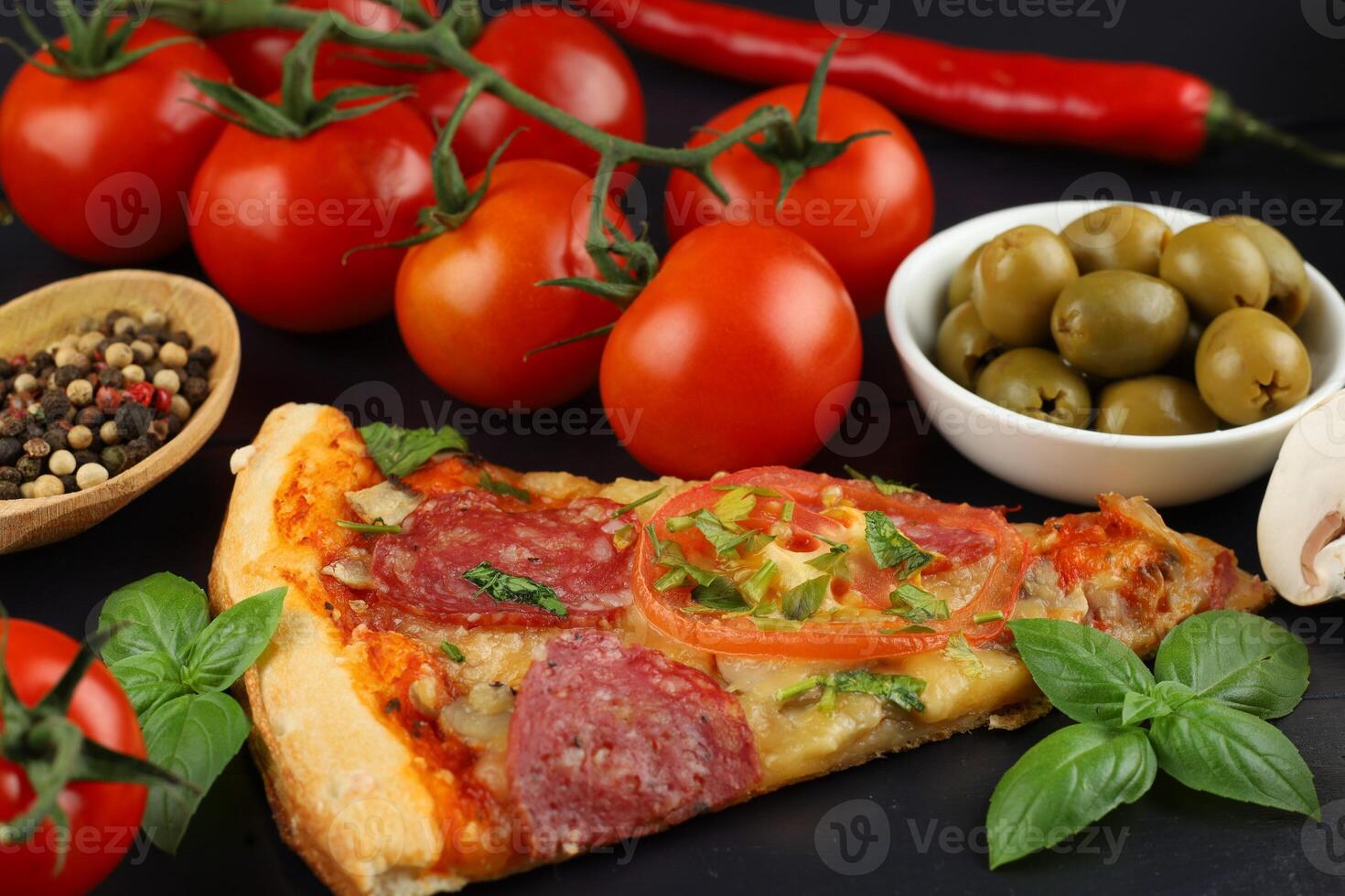 Sliced pizza with vegetables. Pizza on the table photo