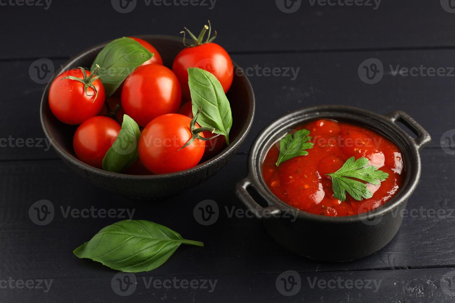 Tomato ketchup with tomatoes. Fresh tomatoes with paste. Tomato cherry sauce in bowl photo