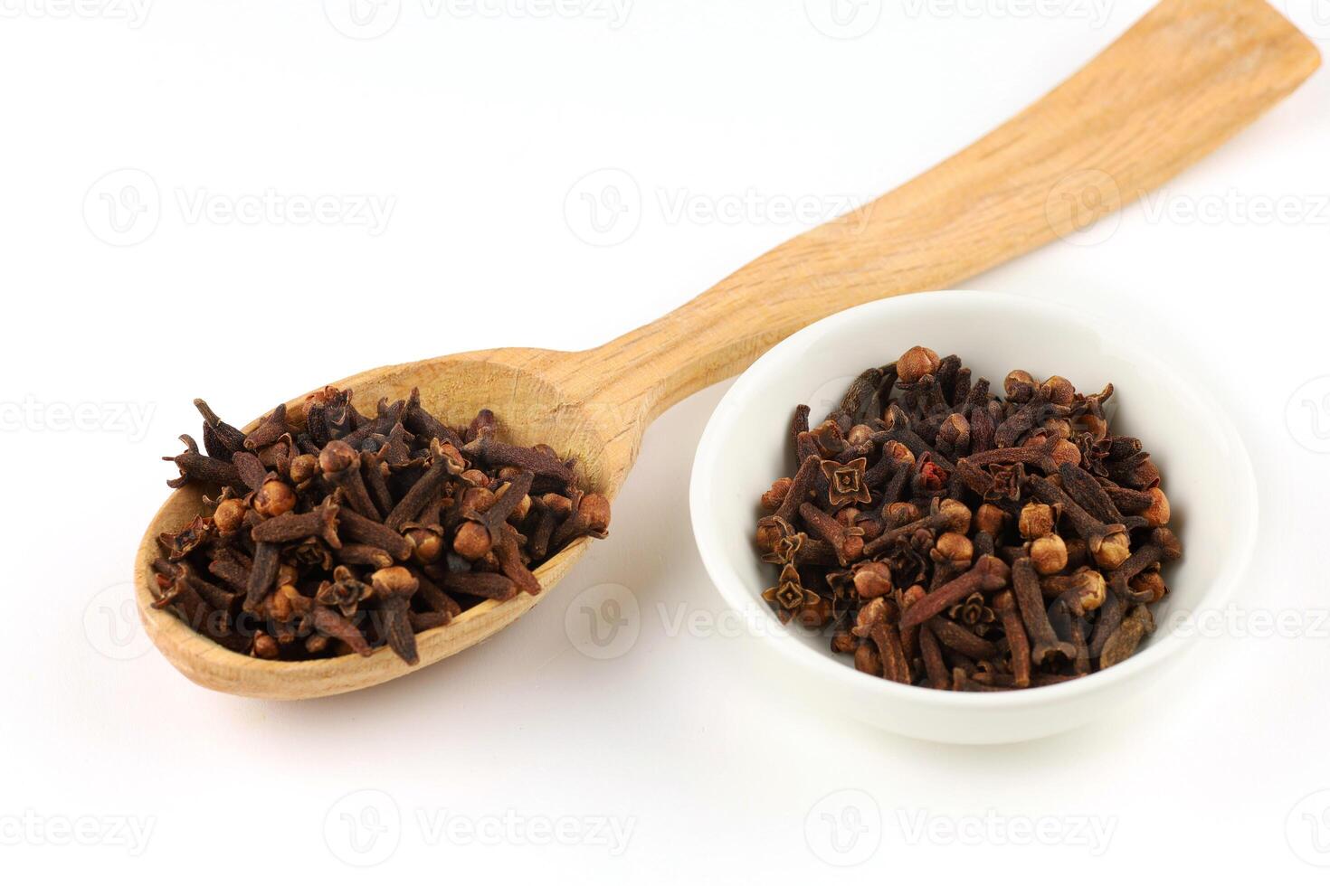 Clove spice in a wooden spoon photo