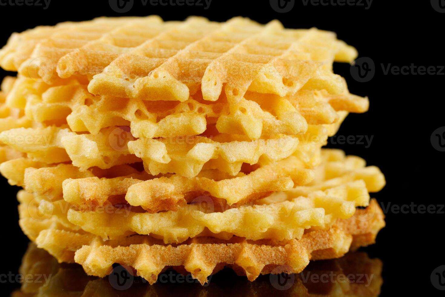 Belgian waffles on a black background. Viennese wafers on an empty photo