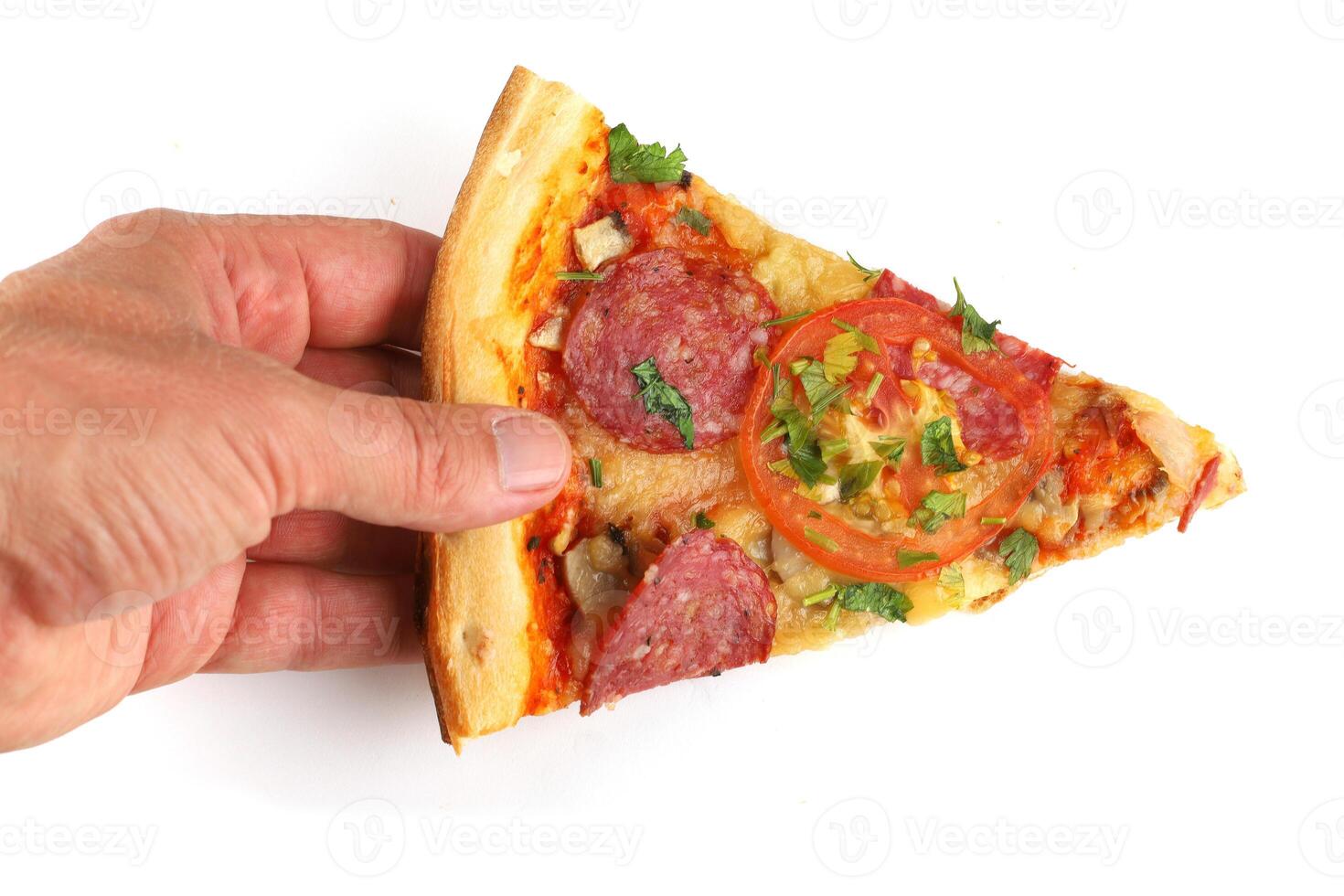 Sliced pizza in hand isolate. Male hand picking tasty pizza slice isolated photo