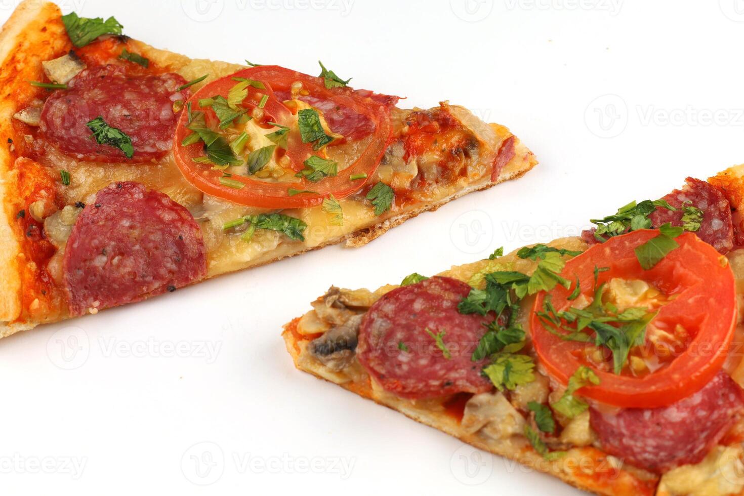 Sliced pizza on white isolate. Two slices of pizza photo