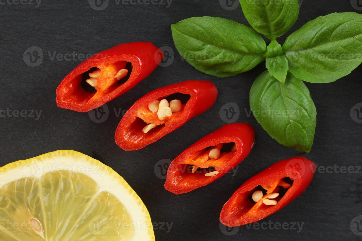Red hot pepper sliced on slate. photo