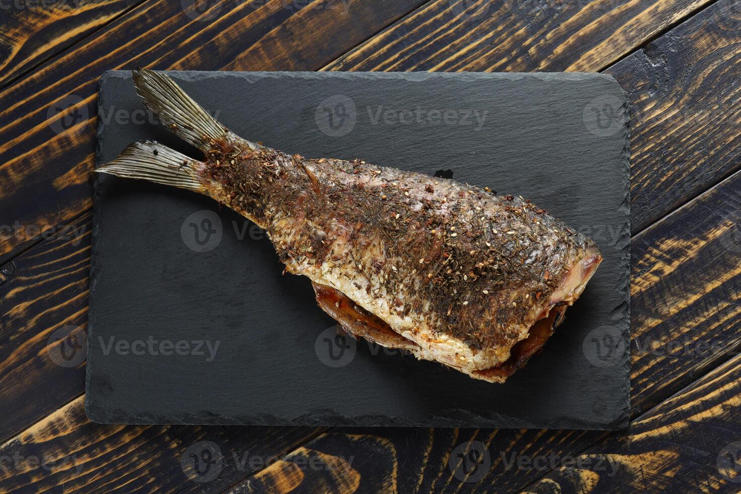 Fried carp fish on the table. photo