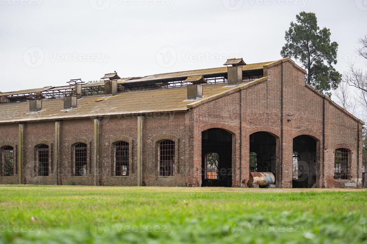Large abandoned train hangar in Argentina photo