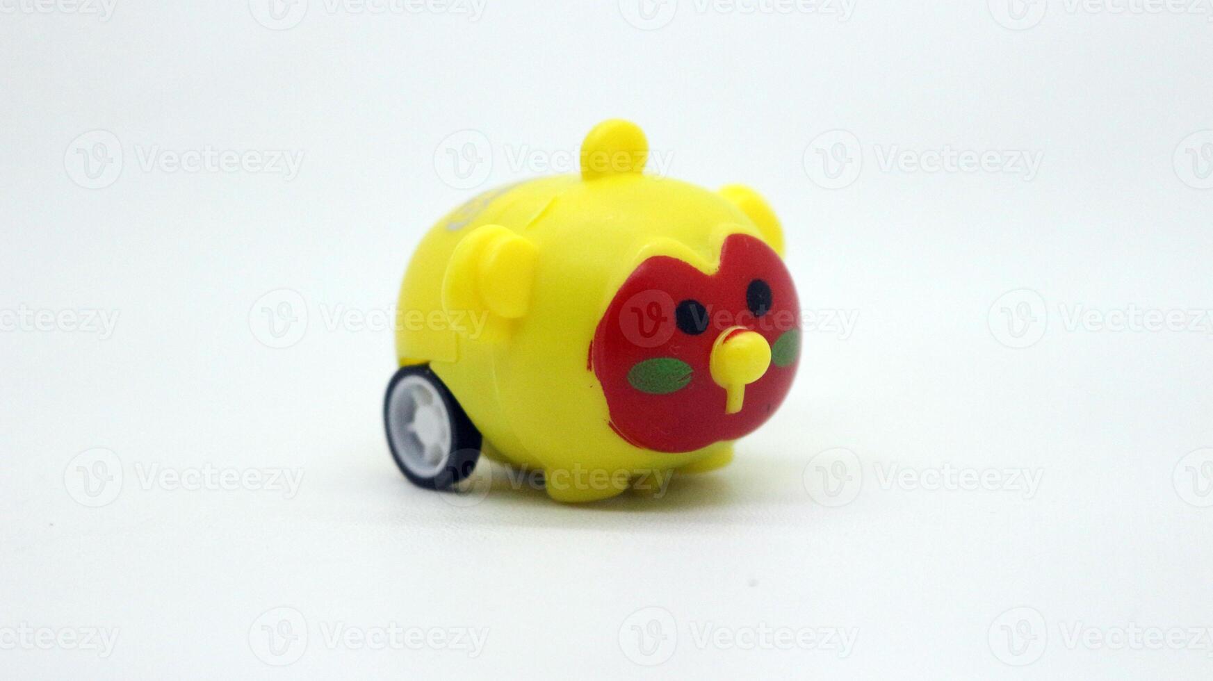 Cute yellow toy car isolated photo