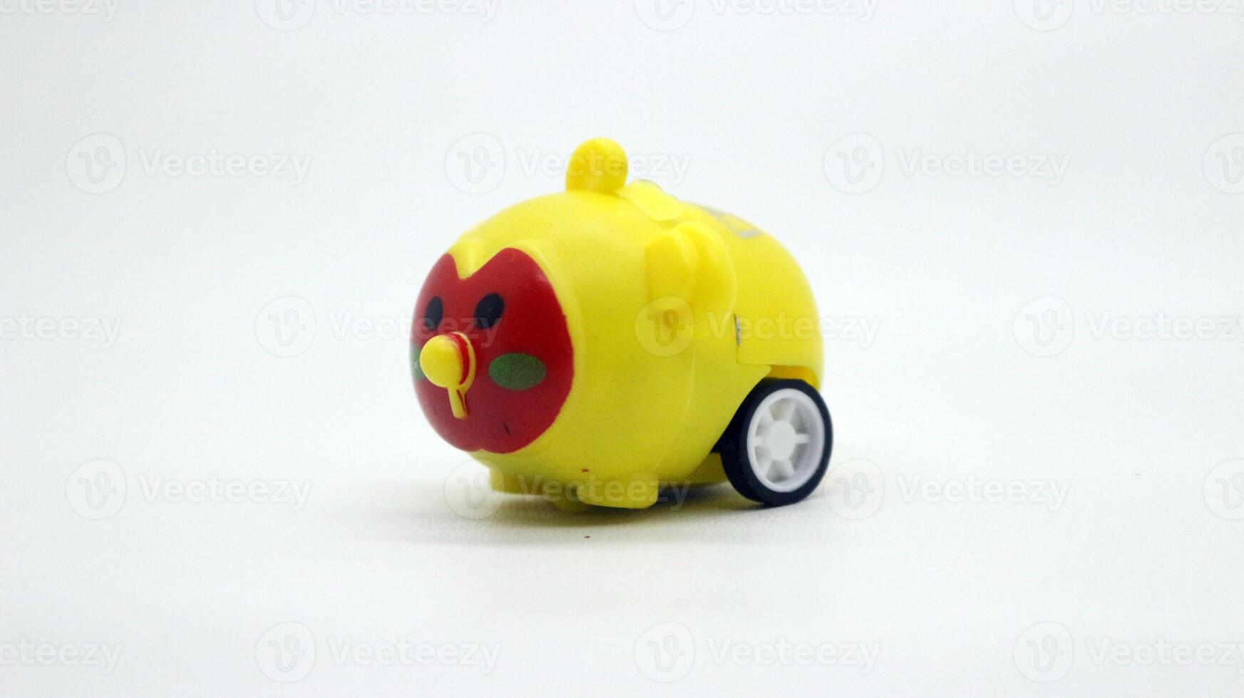 Cute yellow toy car isolated photo