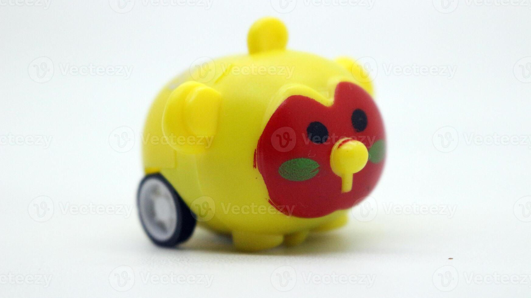 Cute yellow toy car isolated photo