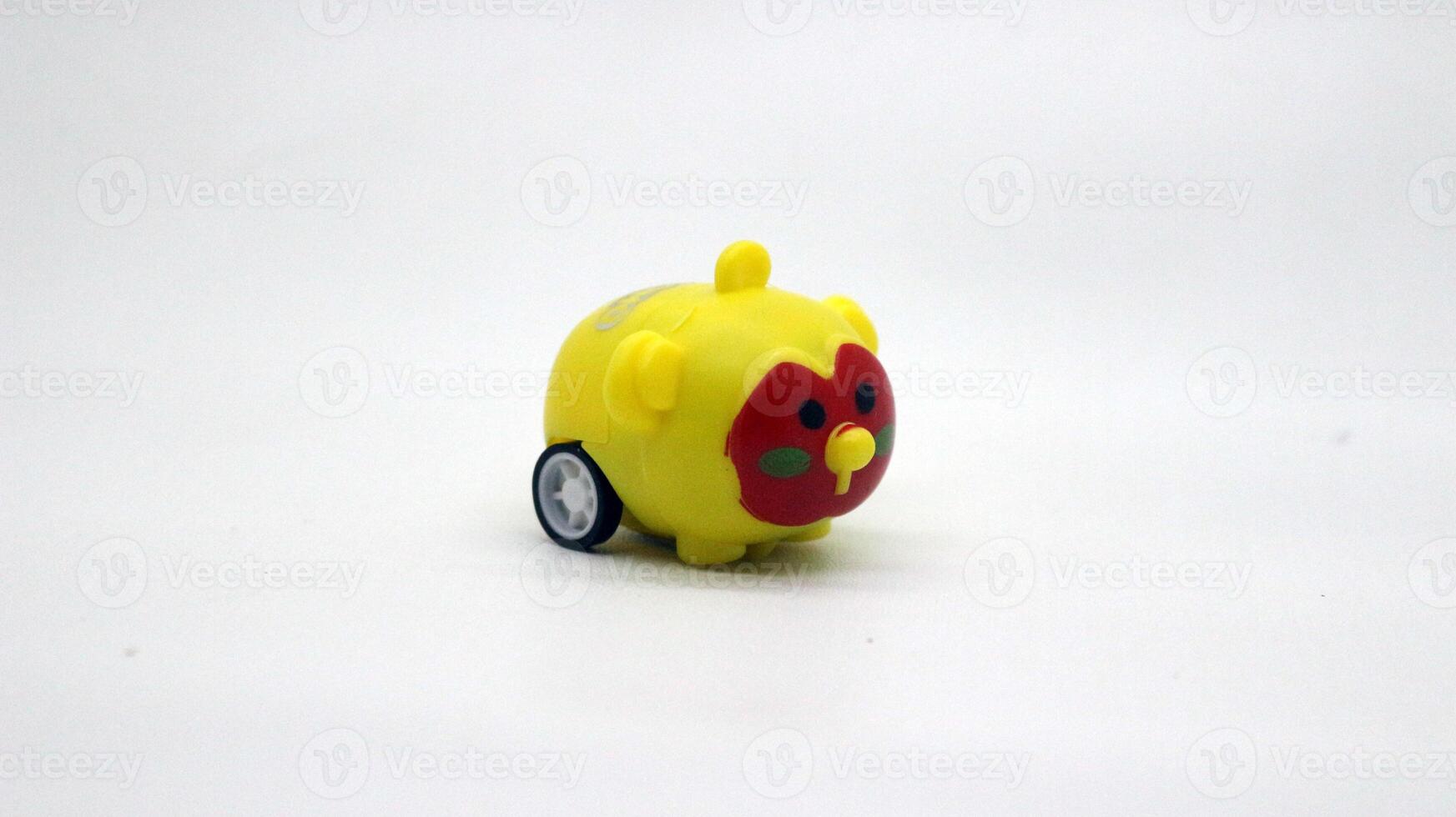 Cute yellow toy car isolated photo