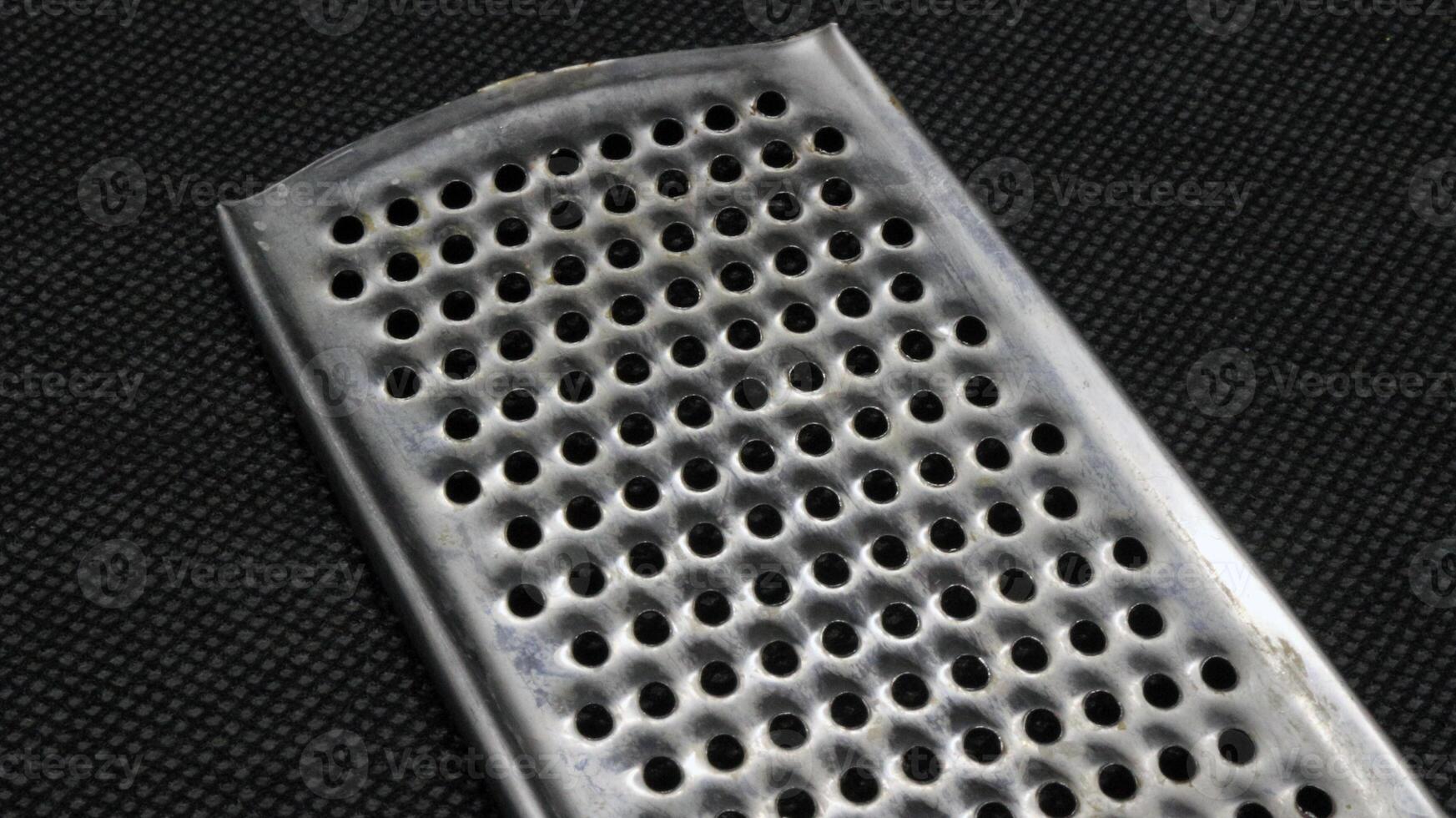 Small metal cheese grater isolated photo