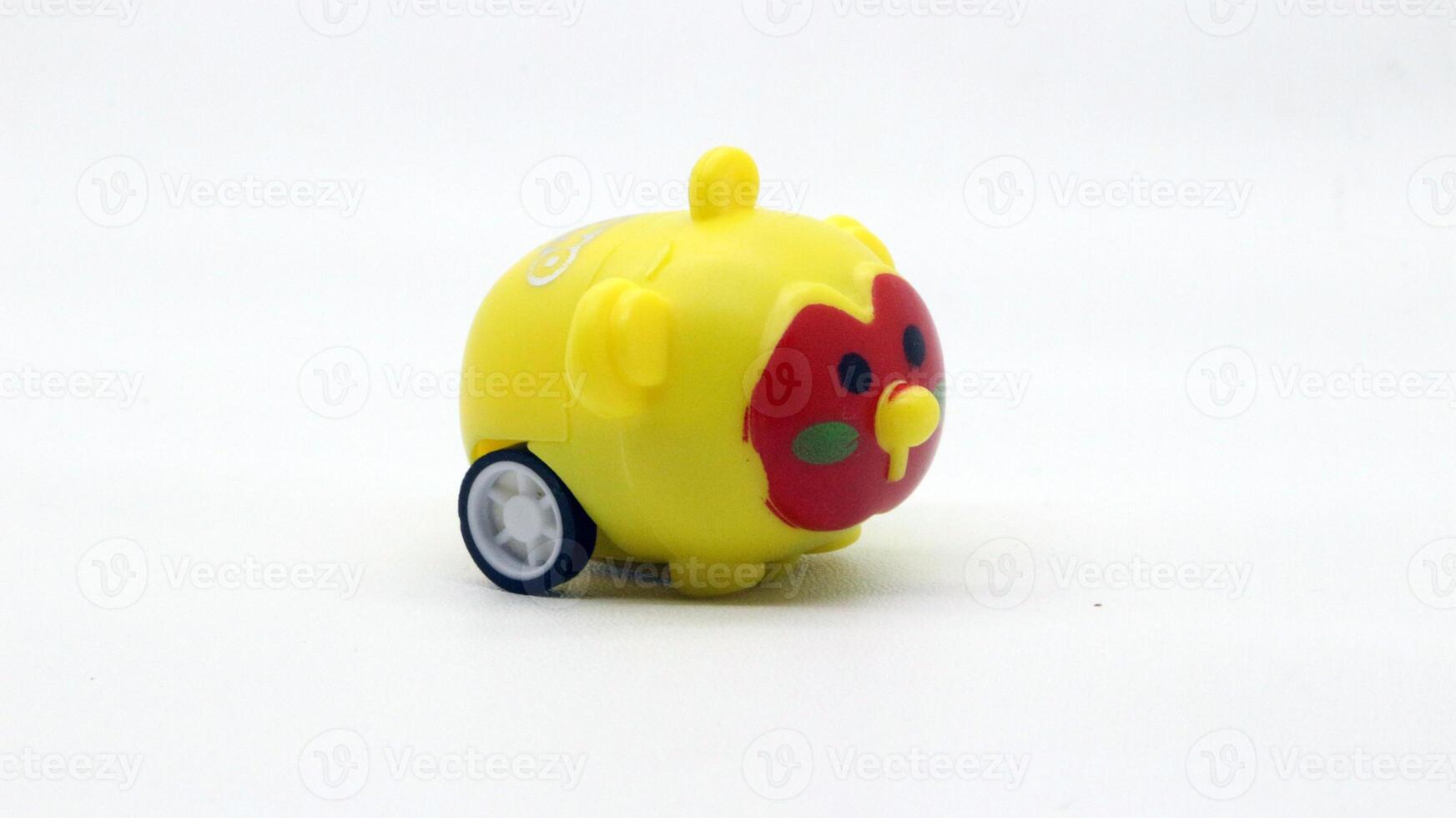 Cute yellow toy car isolated photo