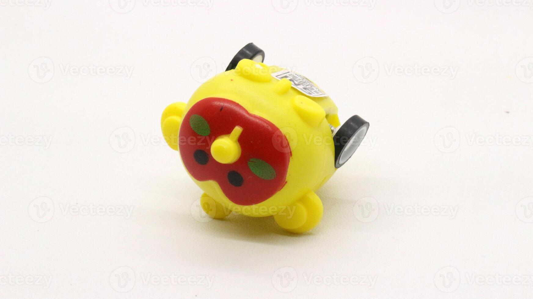 Cute yellow toy car isolated photo