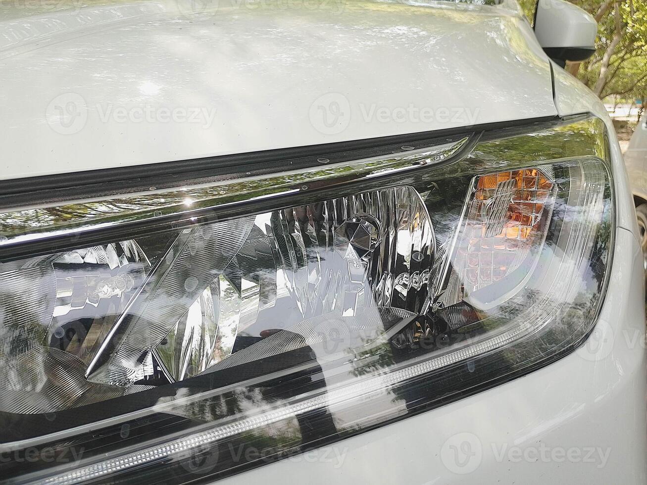 Closeup view of Car Head light with turn signal in it photo